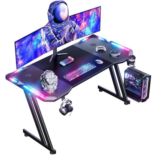 HLONONE Bureau Gaming LED 140 x 60 cm, Bureau Gamer avec Plateau en Fibre de Carbone, Grande Table Gaming, Bureaux Ordinateur avec Tapis de Souris, Porte-gobelet et Crochet pour Casque, Noir